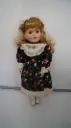 Porcelain Girl Doll Blonde Curly Hair Blue Eyes Floral Dress